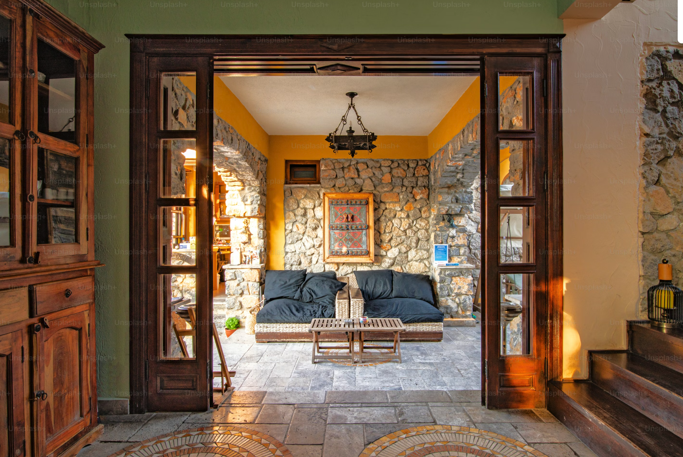 Living room with stone walls and wood stove