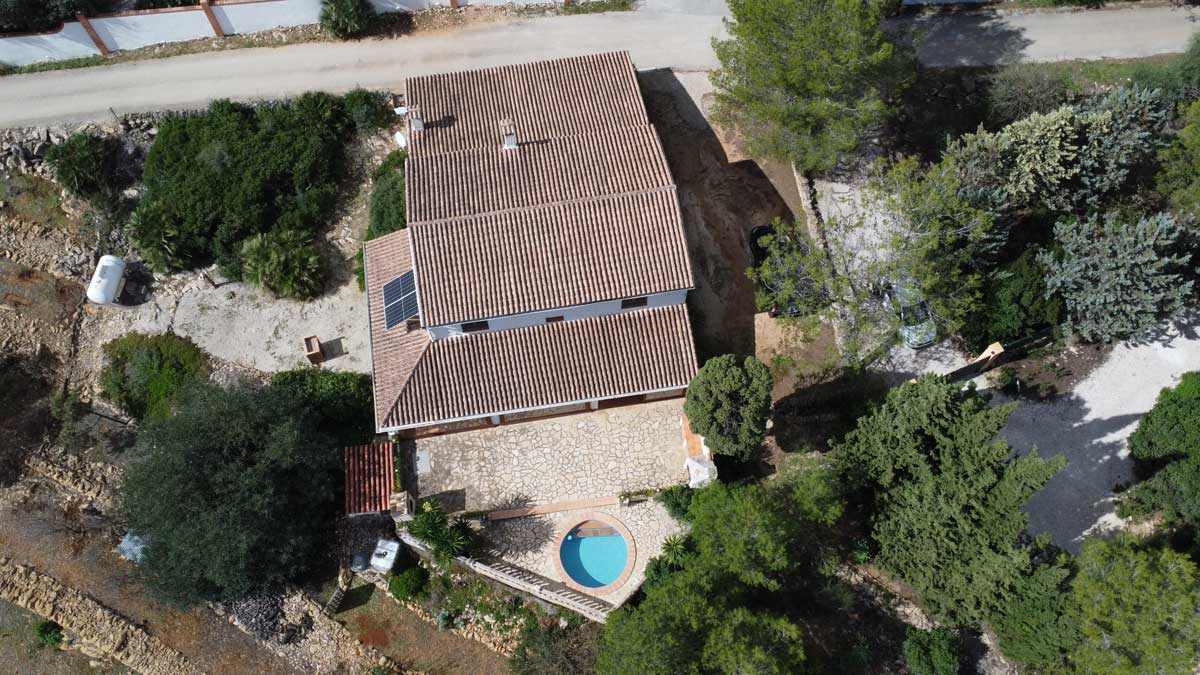 Aerial top shot of finca with pool